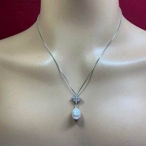Sterling Silver necklace with a single Pearl. 19 inches long